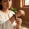Woman wearing black tourmaline crystal bracelet in a warm indoor setting
