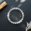 Clear quartz crystal bracelet with natural rainbow light reflections