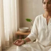 Woman wearing green aventurine bracelet during meditation
