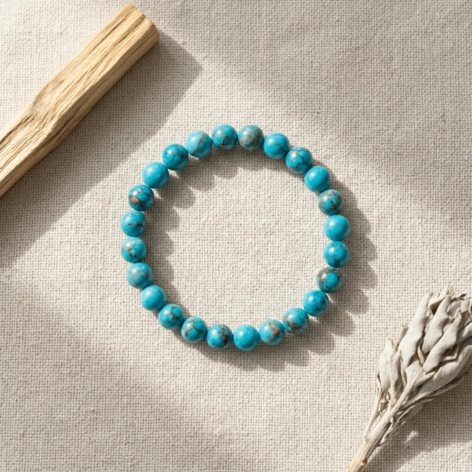 African turquoise crystal bracelet with round blue-green beads on neutral background