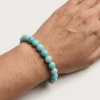 Close-up of 8mm amazonite crystal bracelet on wrist showing bead texture