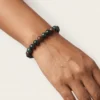 Close-up of a 8mm bloodstone crystal bracelet on wrist highlighting bead size and texture