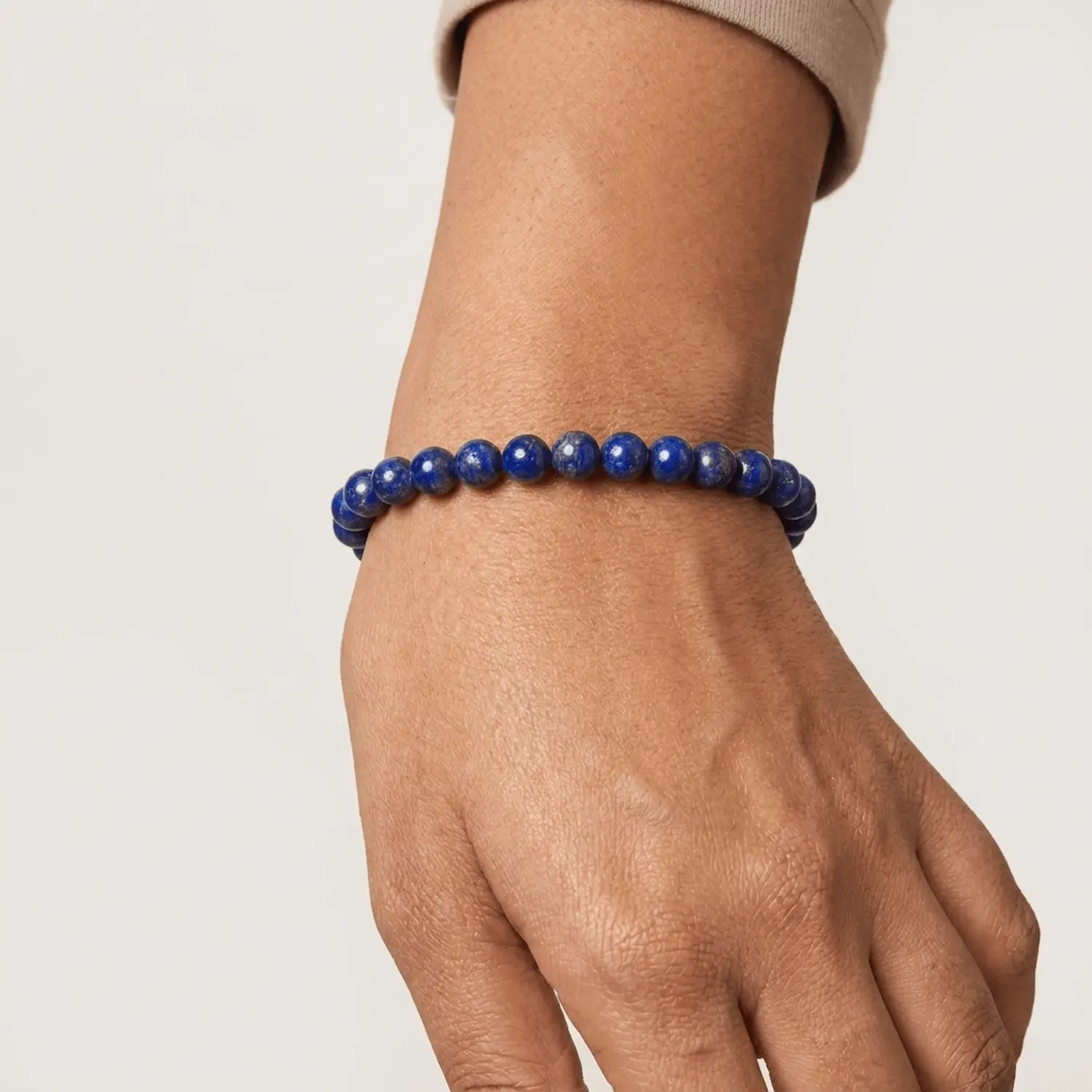 Lapis lazuli crystal bracelet 8mm worn on wrist showing bead size