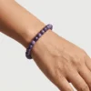 Lepidolite crystal bracelet 8mm worn on wrist showing bead size