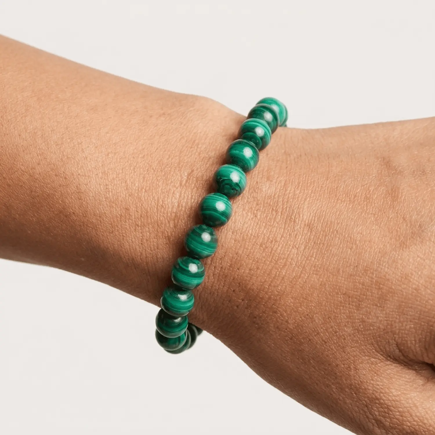 Malachite crystal bracelet 8mm worn on wrist showing bead size and pattern