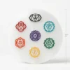 Round selenite chakra plate photographed on a white background
