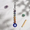 7 Chakra tumble stone hanger with Evil Eye styled with crystals and Palo Santo