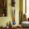 7 Chakra tumble stone hanger with Evil Eye hanging in a meditation and spiritual space