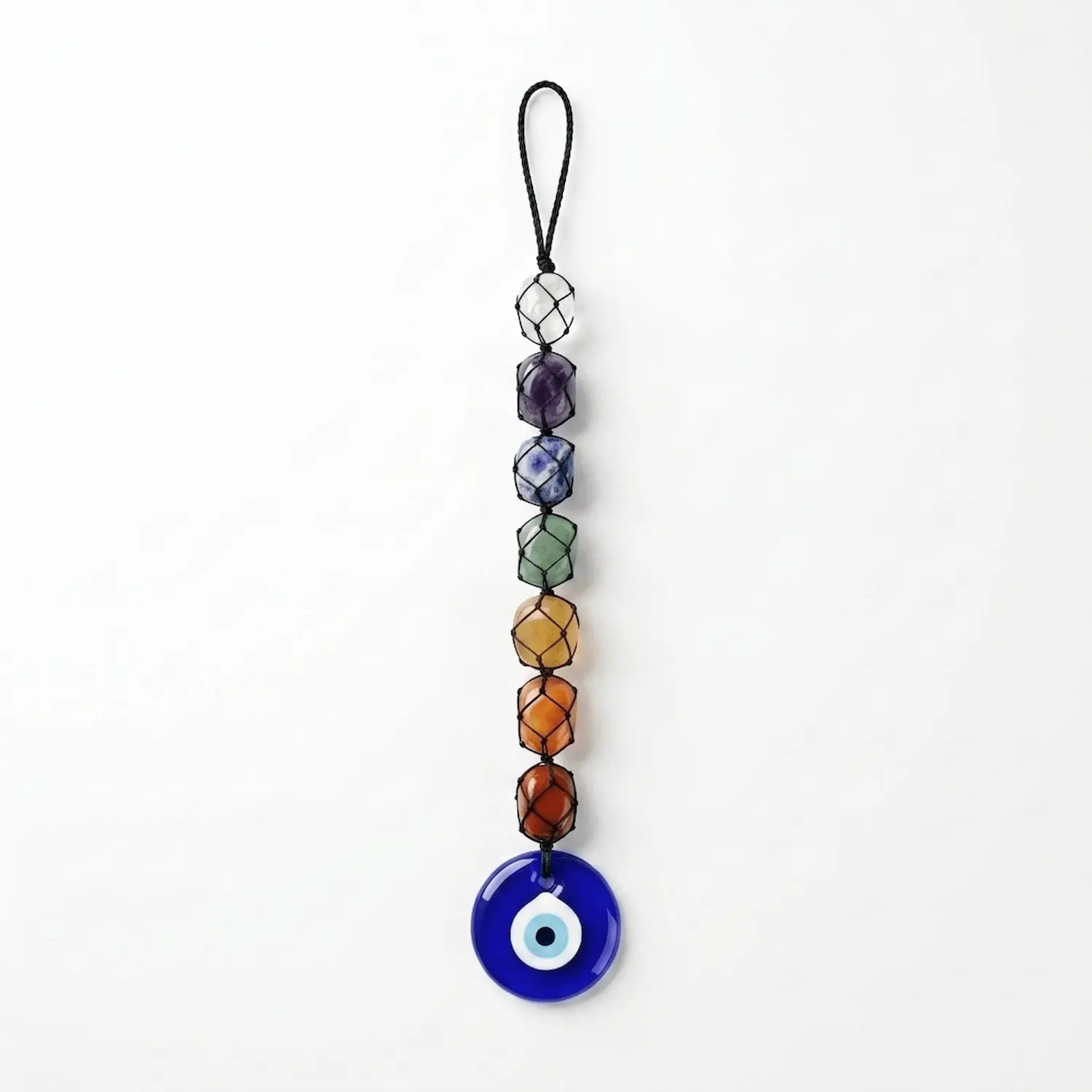 7 Chakra tumble stone hanger with Evil Eye photographed against a clean white background