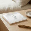 Selenite charging plate styled with a crystal pendant